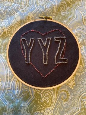 Handcrafted YYZ Embroidery Hoop Wall Art - Black with Red Accent
